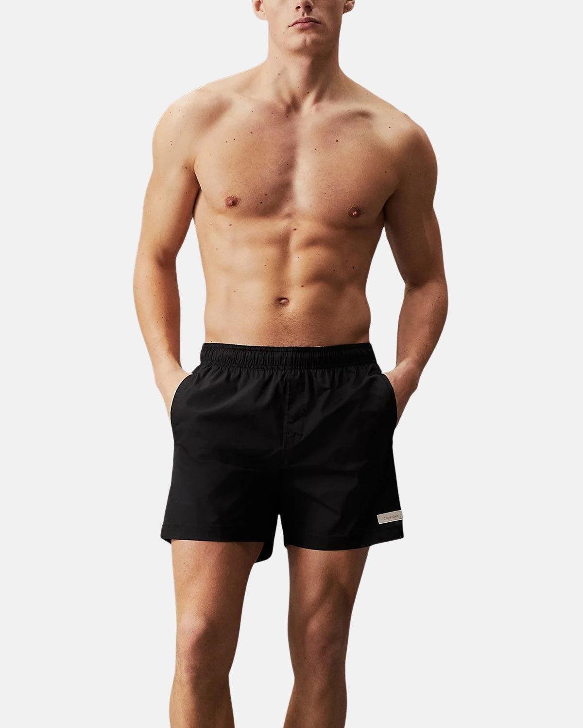 CALVIN KLEIN MEDIUM DRAWSTRING SWIM SHORTS BLACK – CALVIN-KLEIN-KM0KM00939-BEH-S | Studio DOS by Designer Outlet Sales